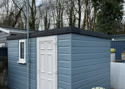 A garden home office fitted with a door and window by GH Windows