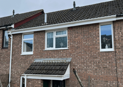 A terraced house fitted with white windows and doors by GH Windows
