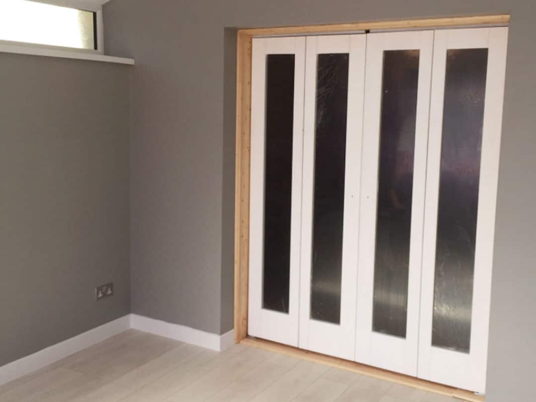 Beautifully repaired folding doors by Gh Windows.